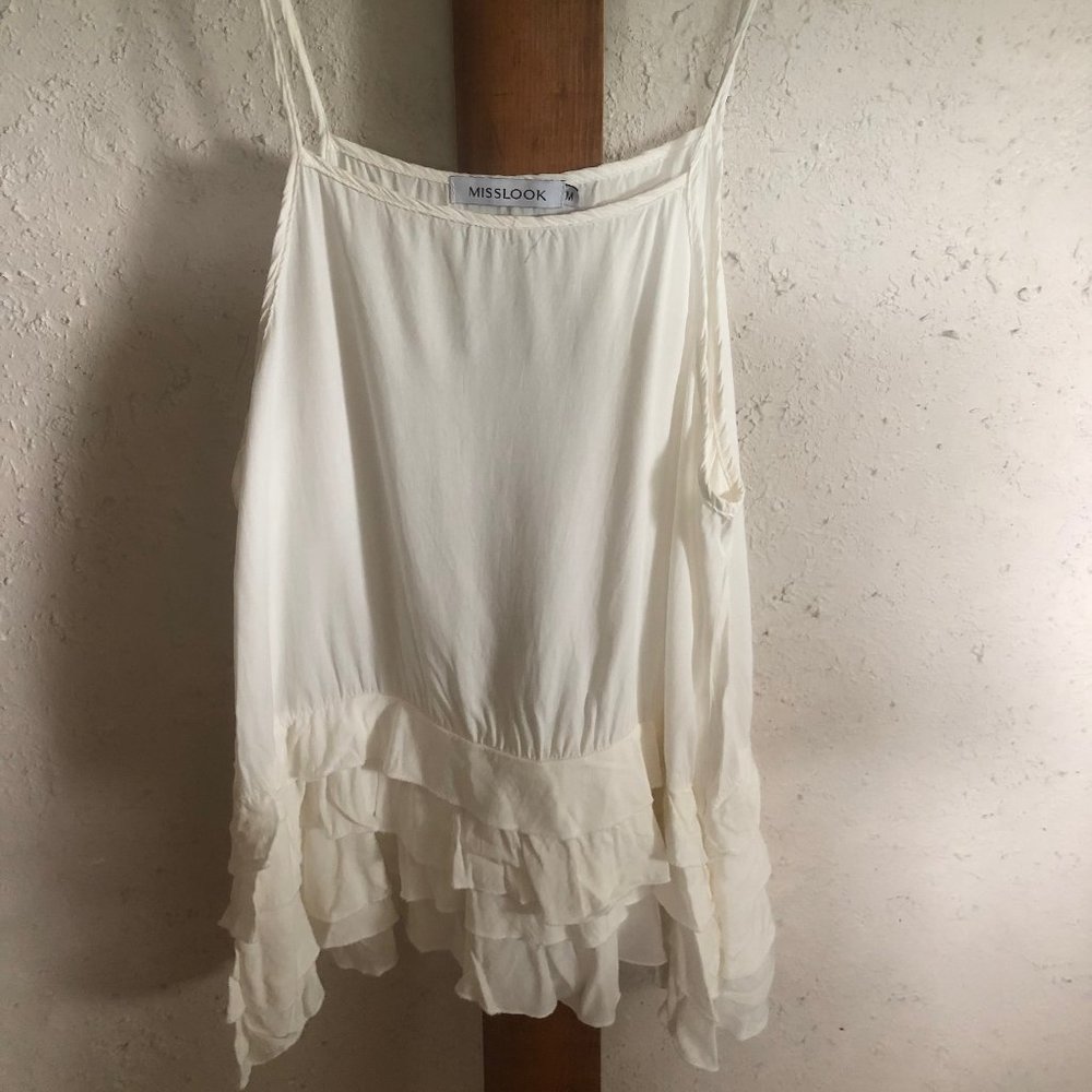white cami with ruffled bottom